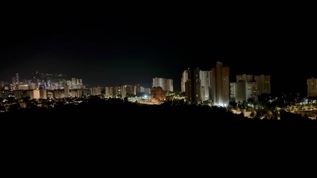 A spectacular night cityscape featuring stunning illuminated buildings and a breathtaking skyline photo