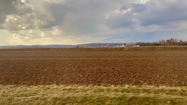 Expansive and Lush Agricultural Landscape Set Against Dramatic and Striking Skies Above photo
