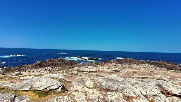 Breathtaking Coastal View Featuring Clear Blue Skies and Incredible Surroundings photo