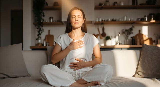 Relaxed calm woman resting breathing, mental balance at home on sofa photo