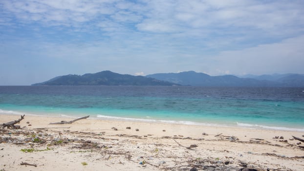 Tropical Beach with Mountains in the Distance photo