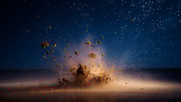 Dynamic splash of dark soil against a night sky full of stars creating an explosive visual moment of impact photo