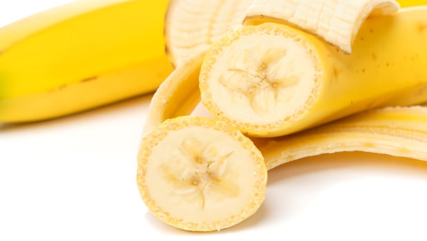 Fresh Ripe Bananas on White Background Healthy Tropical Fruit Close Up Still Life Photography photo