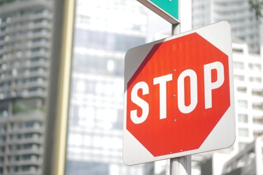 Bright stop sign in an urban setting during daytime photo