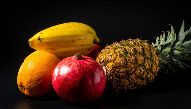 Still Life Composition of Tropical Fruits with Dark Background and Dramatic Lighting photo