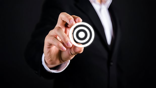 Businessman Holding Target in Hand Symbolizing Goals and Achievement in Corporate World for Success photo