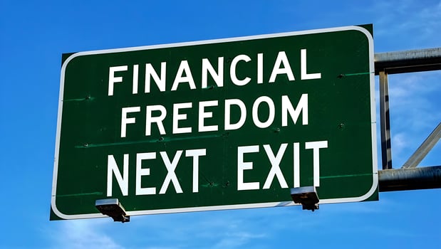 Financial Freedom Next Exit Sign Encouraging Investment and Savings for Retirement Planning and Wealth Creation on Blue Sky Background photo