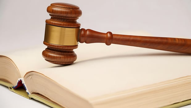 Wooden Gavel and Legal Book Symbolizing Justice Legal System and Courtroom Procedure Open Law Book with Gavel photo