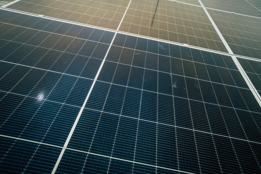 Solar panels harnessing sunlight on a clear day at a renewable energy facility in the afternoon photo