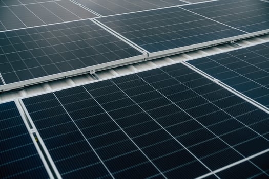 Solar panels installed on a rooftop demonstrating renewable energy solutions in urban settings during daytime photo