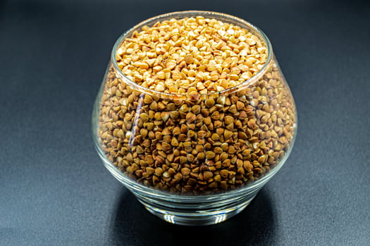 Organic dry buckwheat grains consisting of raw natural products photo