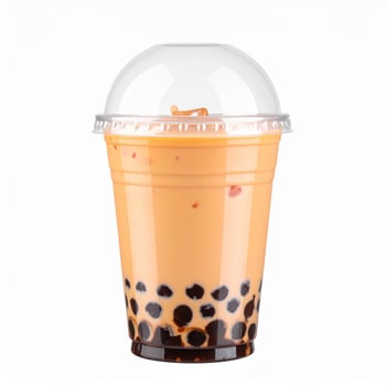 Thai Boba Tea in Clear Plastic Cup with Tapioca Pearls on White Background photo
