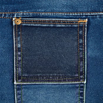 Close Up Detailed Texture of Dark Blue Denim Jeans Pocket with Yellow Stitches photo