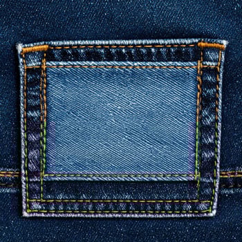 Detailed Close Up Of A Denim Jean Pocket with Blue Fabric and Orange Stitching photo