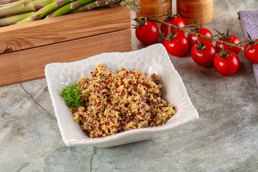 A white bowl filled with a mixture of rice and vegetables photo