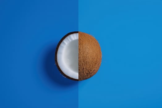 coconut halves on blue background. photo