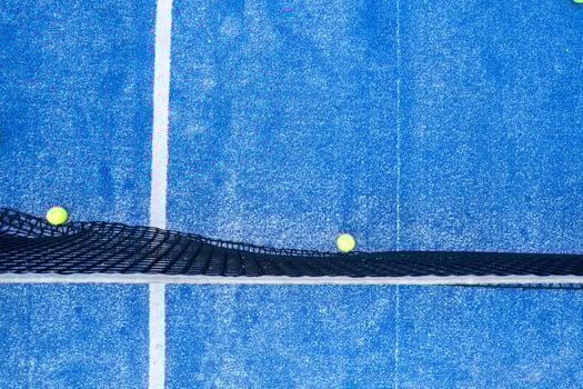 A Top Down Shot of a Net and White Line on a Court. Concept The geometric patterns of sports. photo