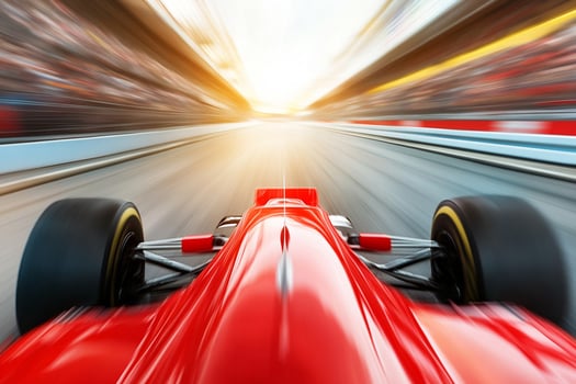 A racing car driving on a track with motion blur photo
