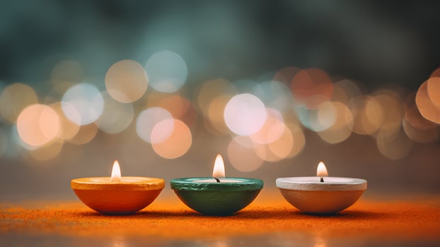 Three traditional Indian diyas in saffron, green, and white colors, symbolizing Indian Independence Day. Soft bokeh background enhances festive atmosphere. India, Indian Independence Day. photo