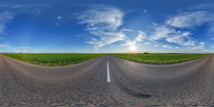 360 degree panorama of a road with a green field in the background photo