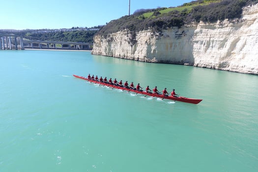A long boat with many people on it photo