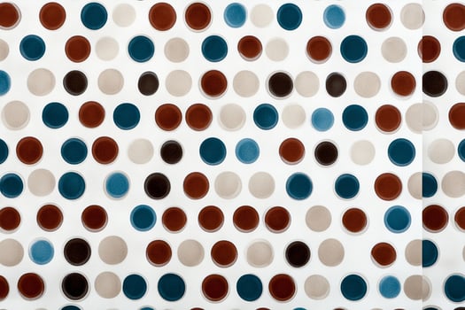 A blue and brown polka dot pattern on a white background photo