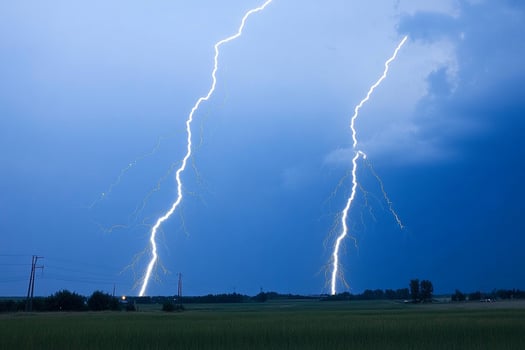 Two lightning bolts are seen in the sky photo