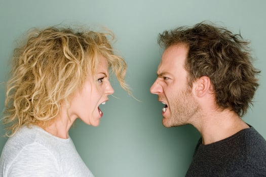 A man and woman are facing each other photo