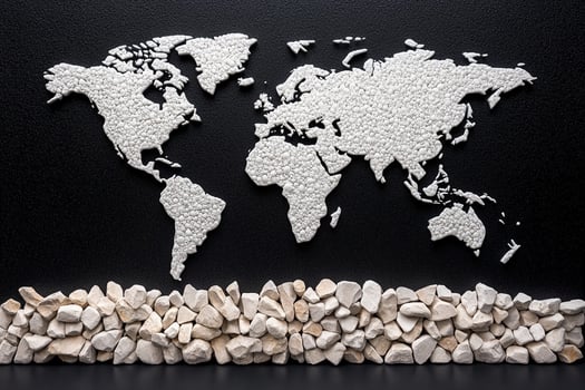 World map made of rocks and pebbles on black background photo