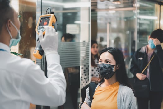A man wearing a mask and a woman wearing a face mask photo