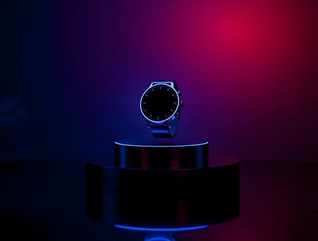 A watch is sitting on a stand with a red light photo