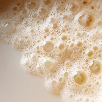 Creamy Coffee Foam With Bubbles Creating a Rich Texture. photo