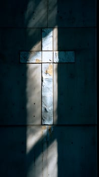 Sunlit Cross Emblem Bathed in Contrasting Light and Shadow. photo