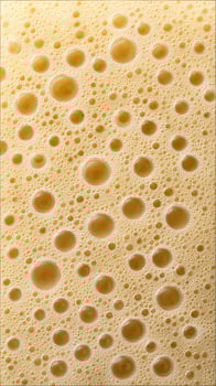 Macro View of Refreshing Golden Bubbles on a Light Surface. photo