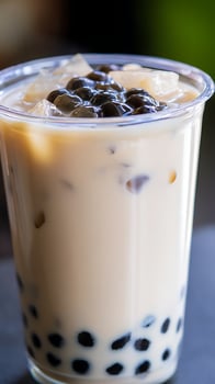Refreshing Bubble Tea with Ice Cubes and Creamy Milk. photo