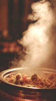 Sizzling Hot Steaming Rice Dish with Savory Ingredients Evaporating Warmth. photo