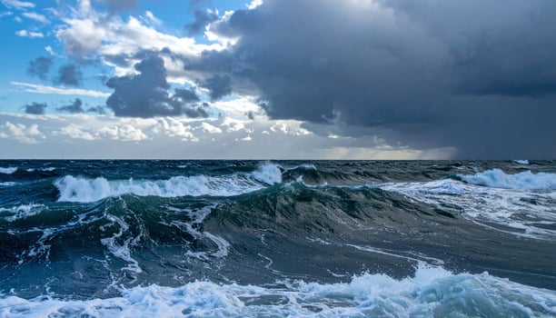 stormy sea with waves and dark clouds photo
