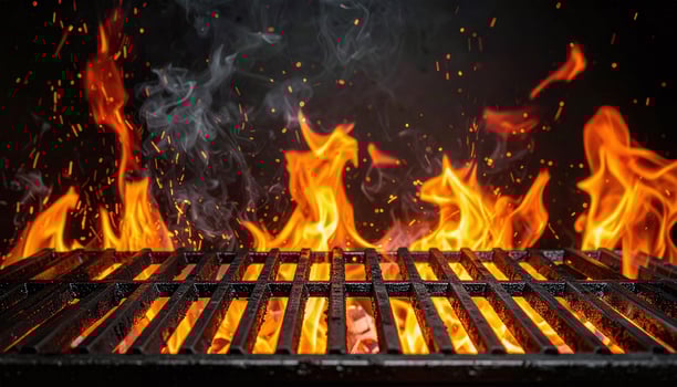 a grill with flames and smoke coming out of it photo