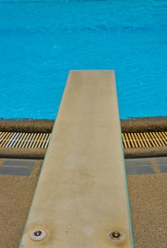 Springboard at swimming pool close up photo