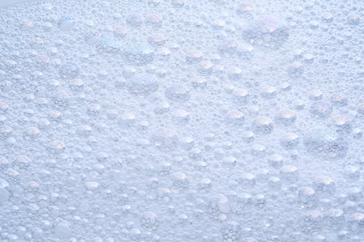 Soap foam with bubbles. The texture of the cleansing product. photo