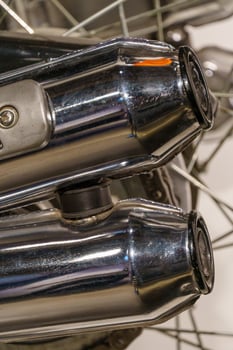 A close up of a motorcycle with two exhaust pipes photo