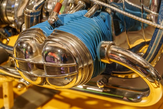 A close up of a blue and chrome engine photo