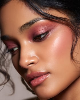 Hyper detailed Indian cheek makeup with ombre blush blending terracotta, plum, rosewood, and golden apricot tones, radiant skin, soft white background photo