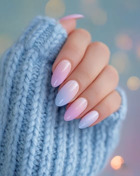 Detailed macro of hand showing pastel summer ombre nails in soft color palette subtle blurry backdrop relaxed beachy and bright seasonal vibe for nail styling photo