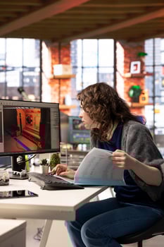 Female developer interacts with virtual AI assistant on PC to design a game hub, using automation and machine learning to generate futuristic space station designs for a sci fi game. photo