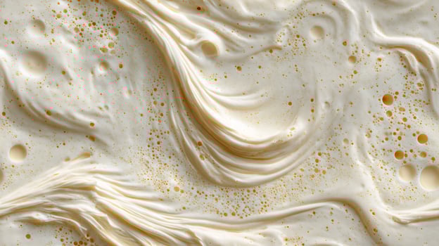 Detailed view of a creamy, frothy substance with small golden bubbles, forming a unique abstract texture. Seamless tile. photo
