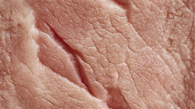 Detailed close-up of raw fresh meat texture. Natural, fibrous background. Seamless tile. photo