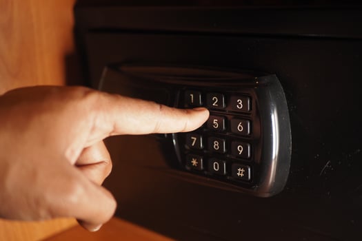 Entering a code on a safe in a modern setting photo