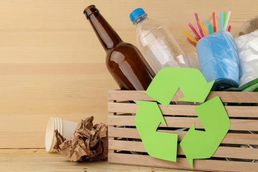 Eco symbol and trash in the box. recycling. waste recycling. on natural wooden background photo