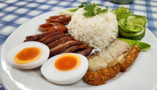 Thai Red Pork, Crispy Pork Belly, and Egg with Rice, Khao Moo Daeng Moo Krob Kai photo